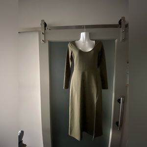 Knee-length long sleeved dress w/ a 1’ slit over left knee. Worn once.